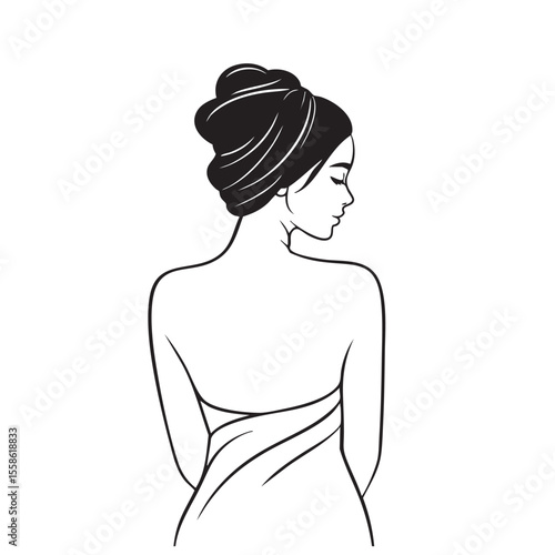 Elegant woman with stylish hair wrapped in towel for spa treatment