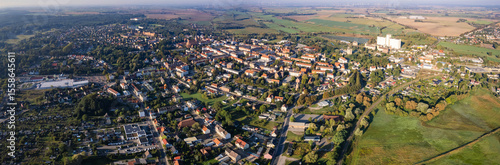 Aerial panoramic view around the old town of the city Pasewalk on a sunny morning in summer in Germany.