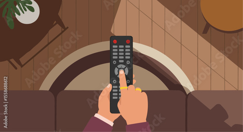 Person using remote control while sitting on couch in living room  