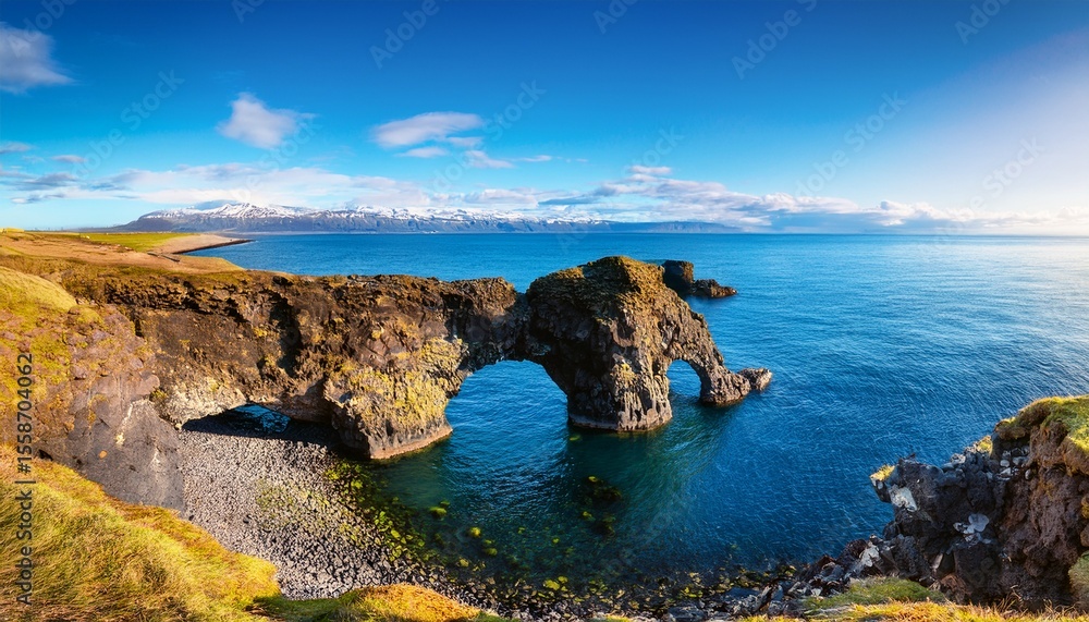 Fototapeta premium famous rock arch at snaefellsnes iceland coast on sunny day