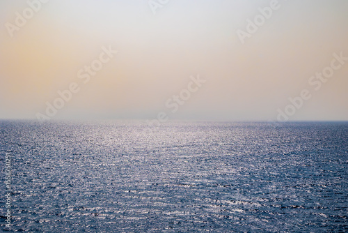Calm blue sea with sun reflections Italy Livorno 10.6.2025