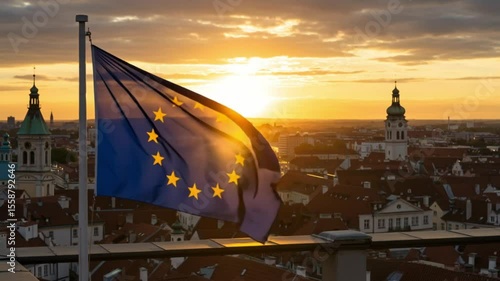European Union flag waving against sunset skyline in city  