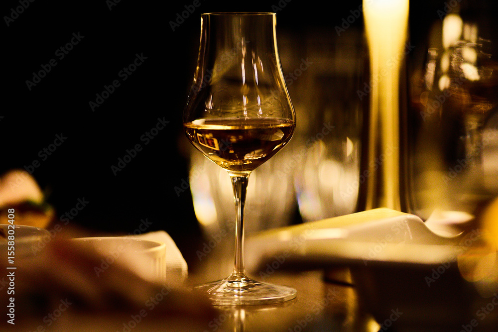 Fototapeta premium Luxury whiskey glasses in warm lighting