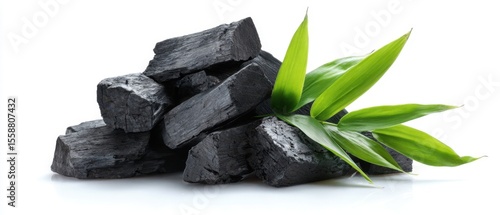 Panel kuchenny z motywem The charcoal pieces with fresh bamboo leaves arranged beautifully.