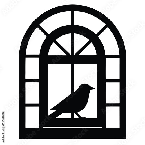 Silhouette of a bird perched on a windowsill inside an arched window