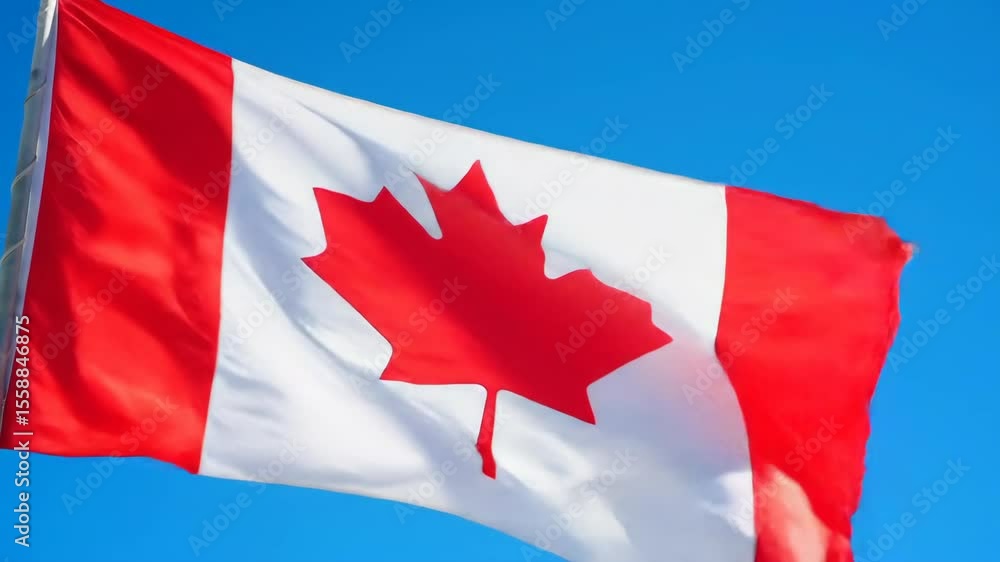 Canadian flag waving against clear blue sky in gentle breeze, symbolizing national pride and unity Canadian flag waving against clear blue sky in gentle breeze, symbolizing national pride and unity