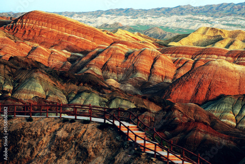 Amazing scenery of Rainbow mountain and blue sky background in sunset. Zhangye Danxia National Geopark, Gansu, China. Colorful landscape, rainbow hills, unusual colored rocks, sandstone erosion