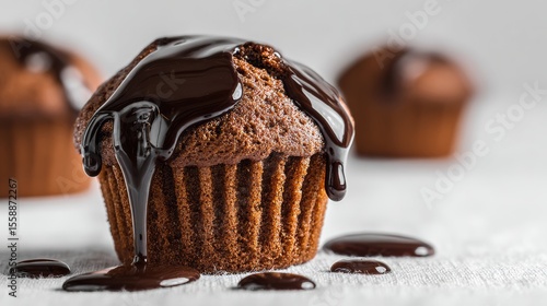 World Chocolate Day concept - 7 july. Muffins with chocolate sauce over white
