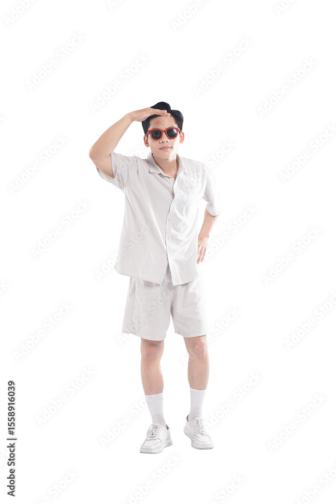 Fototapeta premium Asian guy wearing tourist clothes and sunglasses posing, travel concept