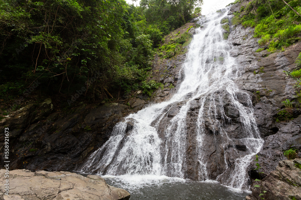 Naklejka premium beautiful waterfall in Thailand ,tropical nature in sarika waterfall at nakhon nayok province, Thailand