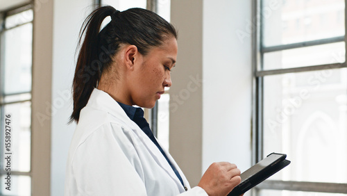 Slika na platnu Dedicated Medical Professional Conducting Digital Records Management in Modern F