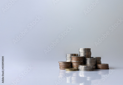 Stacked coins on white background