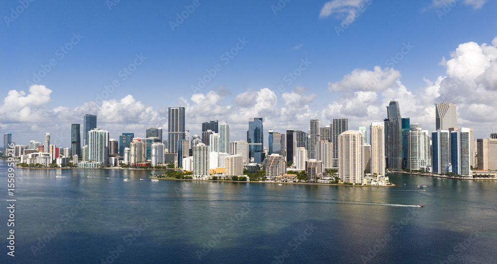 Aerial panorama of Brickell in Miami. Downtown Miami skyline on a sunny day. Scenic view of Miami Beach and Brickell. Miamis Skyscrapers. Brickell famous landmarks. Miami downtown landscape. Aerial panorama of Brickell in Miami. Downtown Miami skyline on a sunny day. Scenic view of Miami Beach and Brickell. Miamis Skyscrapers. Brickell famous landmarks. Miami downtown landscape.