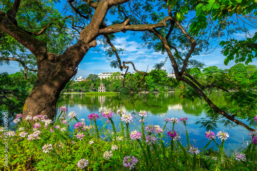 View of Turtle Tower at Hoan Kiem Lake in spring with beautiful reflection, an important historical building in Hanoi, Vietnam