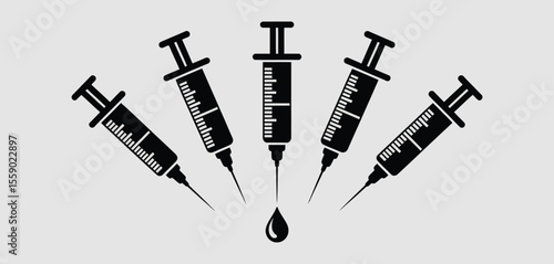 Five Syringes Arranged in a Radial Pattern with a Droplet
