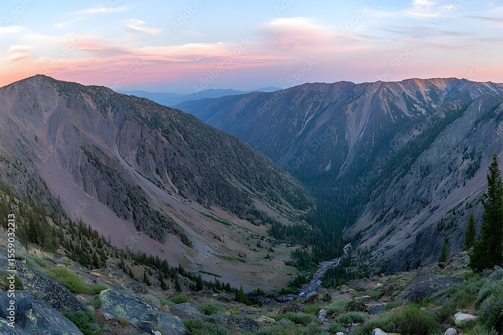 Fototapeta premium Dramatic Mountain Valley at Dusk with Pink Sky and Winding River