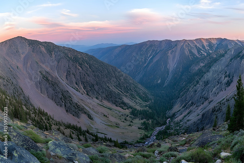 Dramatic Mountain Valley at Dusk with Pink Sky and Winding River