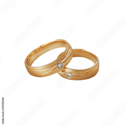 Two gold wedding bands with small diamonds nestled together