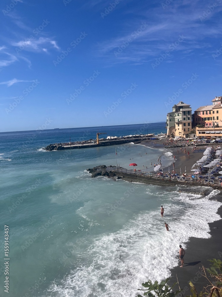 Naklejka premium Bogliasco, Italy — charming coastal village with colorful houses, peaceful beaches, Mediterranean Sea views, lush hills, and authentic Italian Riviera charm.