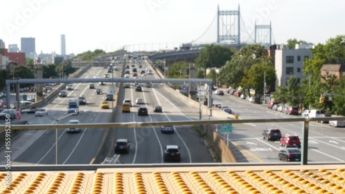 Triborough Bridge in Astoria, Robert F. Kennedy Bridge, New York City. Car traffic on road, multiple lane transport highway from elevated subway station in Queens near Ditmars Steinway, NYC, USA.