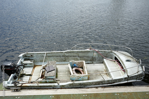 Wallpaper Mural Nottingham, England - June 20 2025: Old weathered motorboat docked on River Trent with signs of rust, mold, and wear. Torontodigital.ca