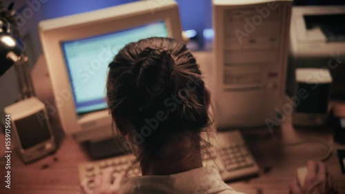 Man working and gaming on retro computer PC, IT engineer with vintage computer at home, using old fashion technology, close up of retro setup. 