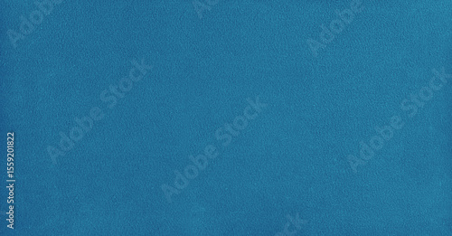 Smooth billiard cloth texture in blue close-up surface view