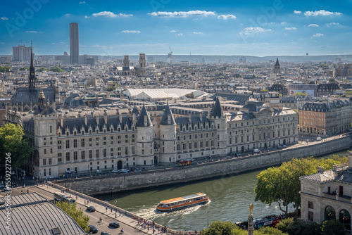 Paris, France - 06 28 2025: Panoramic view of Ile de la Cité, The Seine river, La Conciergerie and West Paris neighborhood from rooftop of Saint-Jacques Tower