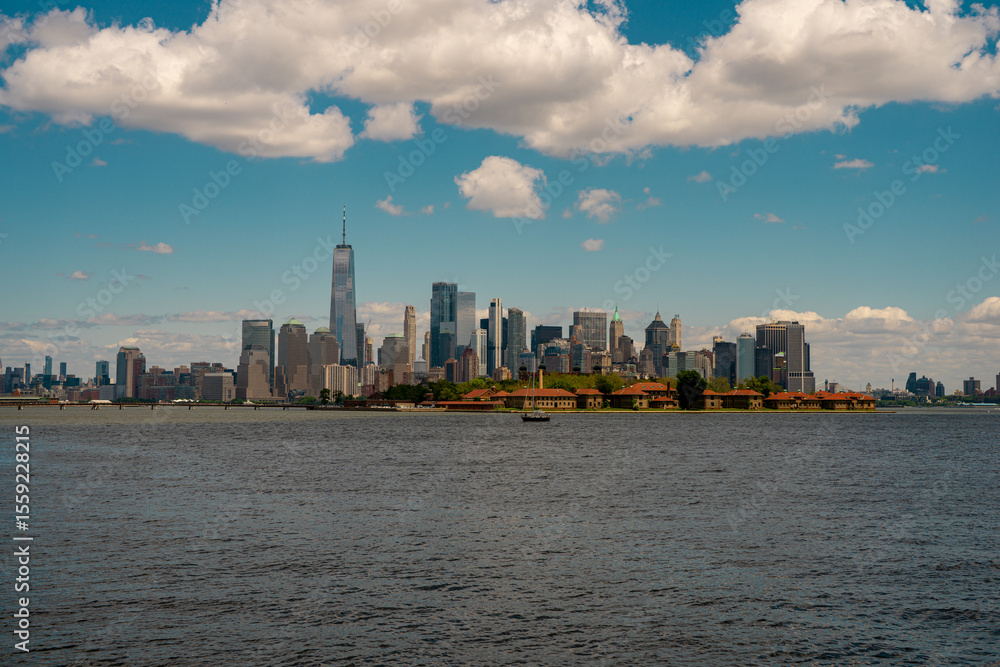 Fototapeta premium New York City. NYC skyline with towering skyscrapers. Manhattan and Hudson River. Panoramic cityscape of New York. Downtown NYC with landmarks. New York skyline. New York reflecting skyscrapers.