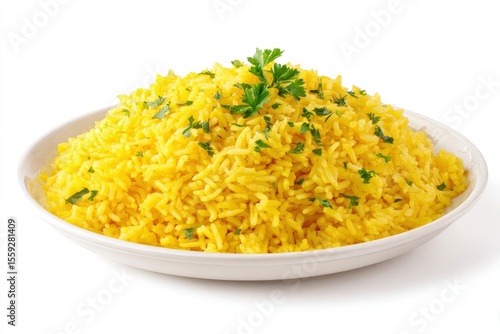 A plate piled with yellow rice is garnished with sprigs of parsley The dish sits on a white surface