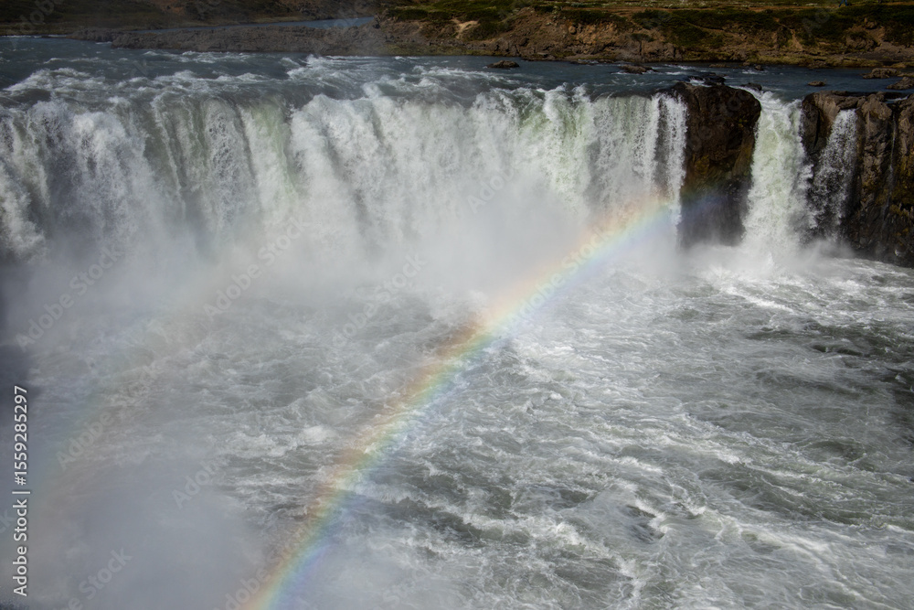 Rainbow in mist over Godafoss Waterfall Rainbow in mist over Godafoss Waterfall