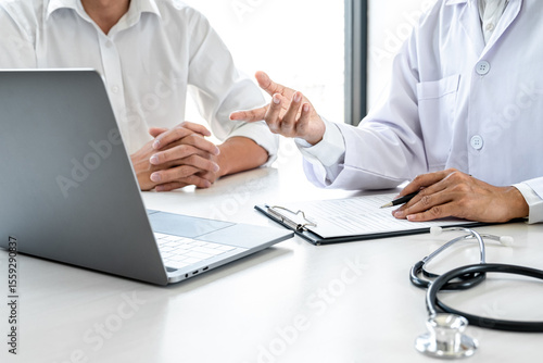 Professor Doctor consulting with patient discussing something and recommend treatment methods, Presenting results on report, Medicine and health care concept
