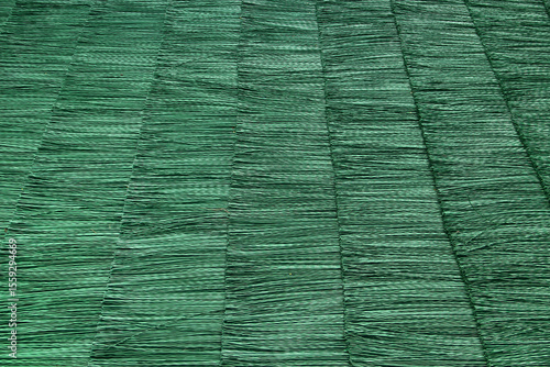Photography Synthetic green polypropylene matting on summer ski jumping hill for year-round