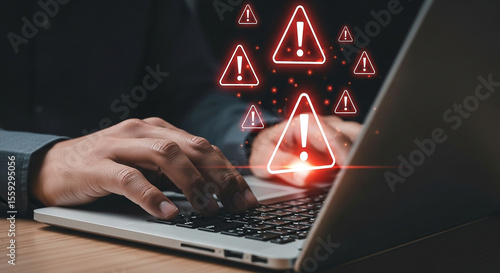 Cyber security threat alert on laptop computer with warning signs for virus malware and data breach risk