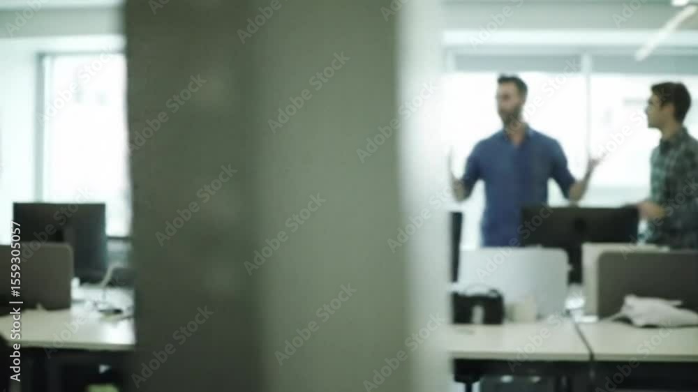 Businessman enters room with modern furniture, blurred depth effect – confident arrival in a professional office environment, featuring soft focus and clean corporate design Businessman enters room with modern furniture, blurred depth effect – confident arrival in a professional office environment, featuring soft focus and clean corporate design