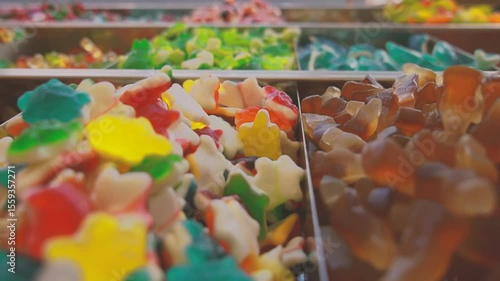 Gummies candy shop market. Turtles gummy candies close up. Muontain of candy inside a market. Lots of colorful candies. Different flavor kandy. Multicolored fruit candies.