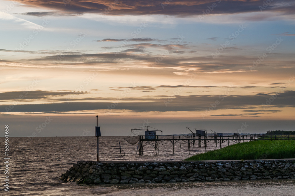 Obraz premium Sunset of Fishing huts over Randonnee entre Histoire et Nature, Fouras, Fouras-les-Bains, Charente-Maritime, Nouvelle-Aquitaine, France, Europe 