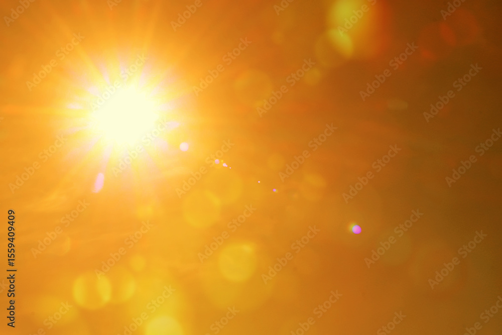 Fototapeta premium Bright sun in orange sky during hot summer weather. Extremely high temperature
