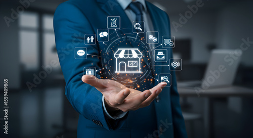 Wallpaper Mural A professional holds a glowing digital marketplace network, symbolizing modern business and interconnected customer engagement. Torontodigital.ca