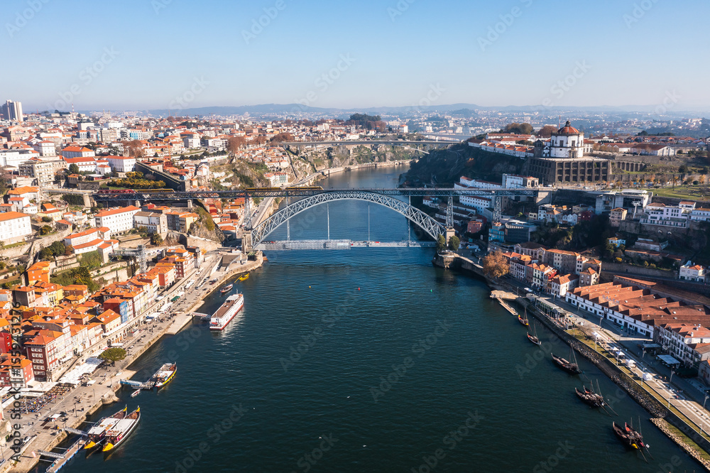 Fototapeta premium Cityscape of the city of Porto, including the Douro river and the Dom Luis I bridge (Ponte de Dom Luís I). Porto, Portugal.