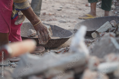 Εκτύπωση καμβά Workers sifting through rubble at a construction site