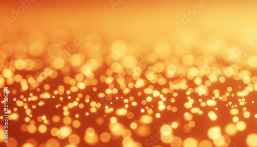 Golden holiday lights glow with a defocused, abstract golden sunset shine and warm bokeh, perfect for a bright Christmas celebration