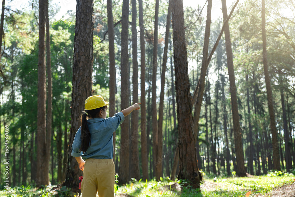 Young Girl Engineer Exploring Forest.Future Environmental Leader Pointing Towards Nature Conservation.Environmental Education and Forest Exploration for Children. esg.STEM learning and environmental. Young Girl Engineer Exploring Forest.Future Environmental Leader Pointing Towards Nature Conservation.Environmental Education and Forest Exploration for Children. esg.STEM learning and environmental.