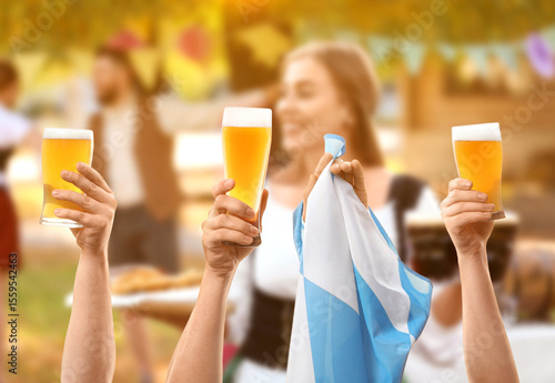 People with beer and flag o...