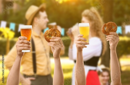 People with beer and pretze...