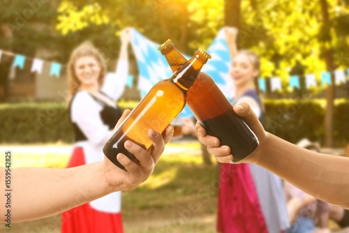 People with bottles of beer...