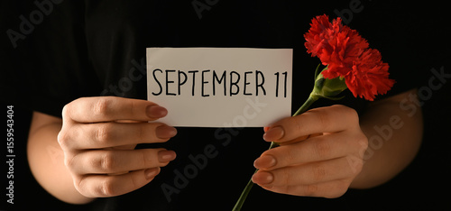 Woman holding paper with da...