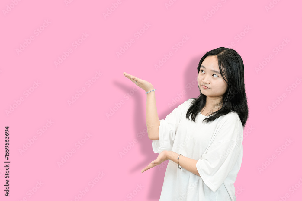 Asian Teenager Girl Presenting Something with Open Hands, Looking Right
Asian Teenager Girl Presenting Something with Open Hands, Looking Right