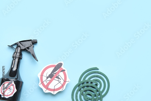 Mosquito repellent spray, spirals and anti insect sign on blue background