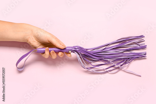 Female hand with whip from ...
